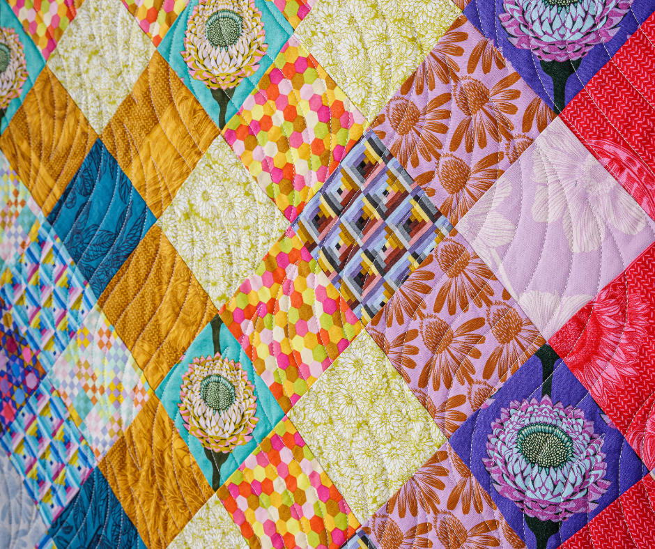 close up of a colorful quilt made with Anna Maria Parry fabrics.