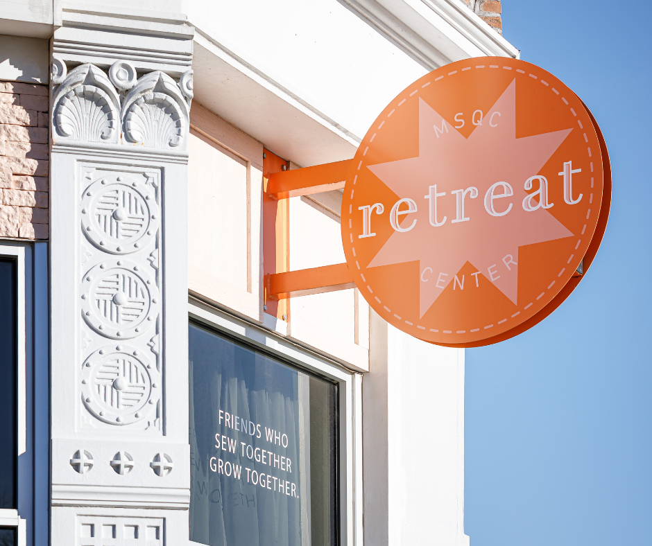 image of an orange sign on a building that says 