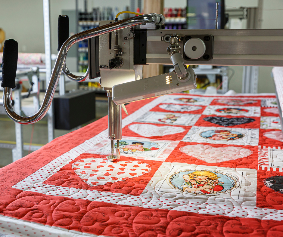 a valentine quilt on a longarm machine.