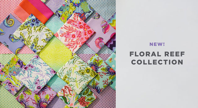 A selection of fat quarter fabrics in bright colors, shells, coral, fish, and more from the Tula Pink Floral Reef collection.