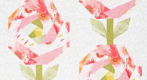 Cheater print with the look of FPP pink flowers on a white background with off-while scrolls.
