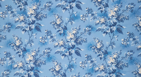108"-wide backing with cream and blue lilacs on a blue background.
