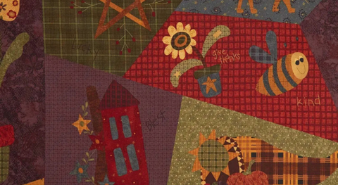 Cotton quilting fabric with a cheater print of a crazy-quilt design featuring autumn colors and motifs.