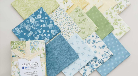 Fat quarter bundle of cotton quilting fabric with floral and mini prints in a blue, green, and yellow palette. 