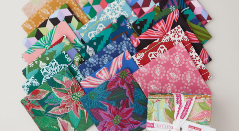 a colorful collection of fat quarter fabrics in non-traditional colors from Anna Maria Parry's Cozy Christmas fabric collection.