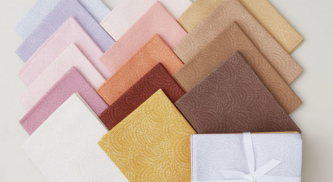 a collection of fat quarter fabrics from the Crimp Basic Fabric Collection.