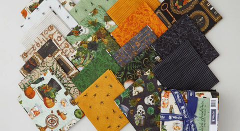 Fat quarter bundle of goth prints in a black, tan, orange, green, and cream palette.