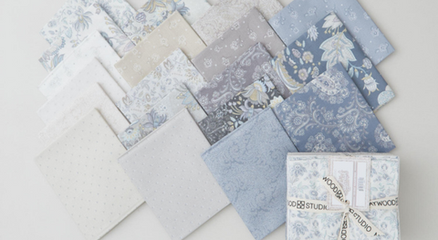a selection of fat quarter prints from the Maywood Studio Daybreak fabric collection.