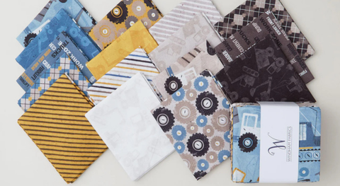 a selection of fat quarter prints from the Diggers and Dozers fabric collection.