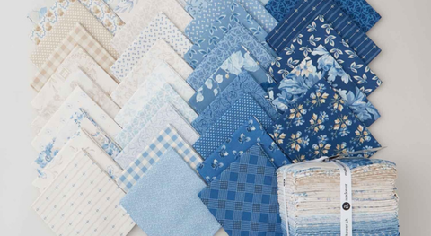Fat quarter bundle of cotton quilting fabric with flowers and mini prints in shades of blue, cream, and tan from Edyta Sitar's newest fabric collection for Andover, Special Delivery.