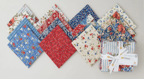 Fat quarter fabrics with prints of dainty flowers and other small designs from the Farmhouse Sampler fabric collection.