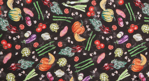 fabric featuring Vegetables tossed on a black background. 
