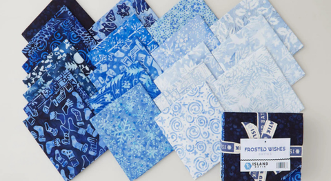 Fat quarter bundle of blue and white batiks with a winter and Christmas theme. It ranges from dark navy to soft sky blue batik prints.