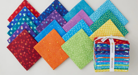 a selection of fat quarter fabrics from the hugs and kisses flannel fabric collection.