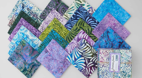 A fat quarter bundle of abstract patterns and flowers in jewel tones. 
