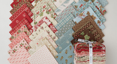 Fat quarter bundle of green, tan, cream, and red prints with a vintage holiday feel.