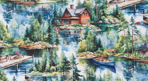 Close-up of quilt fabric with Cabins and lake scenes on a background of blue sky and water. 