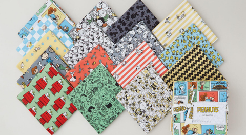 Fat quarter bundle of Peanuts prints in assorted colors.