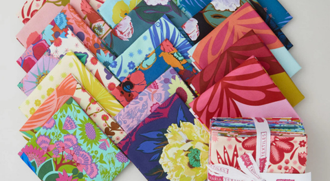 a selection of fat quarter fabric in bold, floral prints, plus three butterfly panels. 