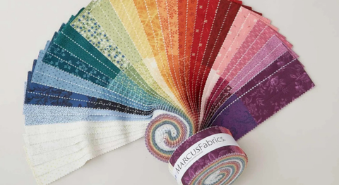 Jelly roll of cotton quilting fabric with flowers and mini prints in assorted colors.