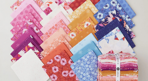 a selection of fat quarter fabrics from the petals and stitches fabric collection by Stephanie Organes.