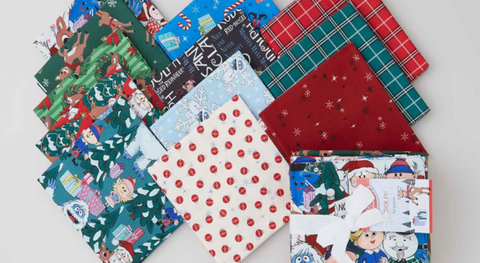 Fat quarter bundle of cotton quilting fabric featuring Rudolph the Red-Nosed Reindeer characters and motifs.