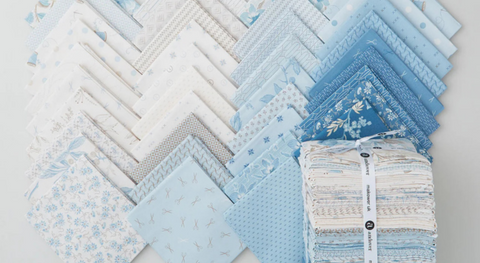 a selection of fat quarter fabric prints from the Sewing Bird fabric collection by Edyta Sitar.