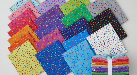 a selection of fat quarter prints in every color of the rainbow from the snips of color fabric collection.