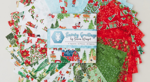 Charm pack of Christmas prints in a red, green, light blue, and white palette. 