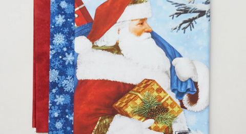 a selection of Christmas quilt fabrics from the St. Nicholas fabric collection.