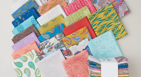 A fat quarter bundle of butterflies, paisley, and other colorful prints from the Sway by Kori fabric collection.