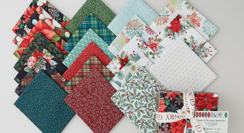 Fat quarter bundle of Christmas and winter-themed prints from the Sweet Christmas Memories fabric collection.