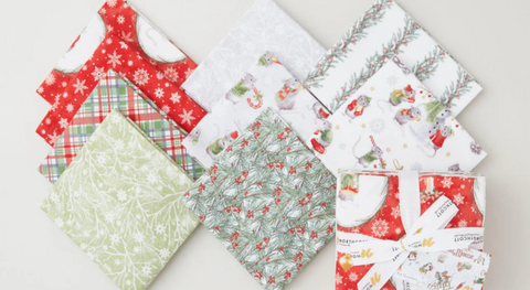 A selection of Fat quarters of whimsical Christmas flannel fabric prints from The Christmas Mouse collection.