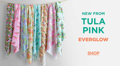 Shop the tula pink everglow fabric collection here.