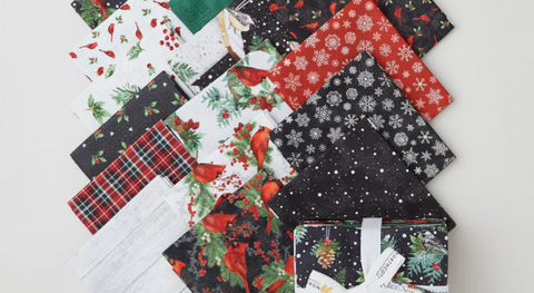 a selection of fat quarter fabrics from the winter song fabric collection.