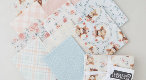 a selection of fat quarter prints featuring adorable highland cows as well as mini dots, ditsy flowers, and bias plaid.