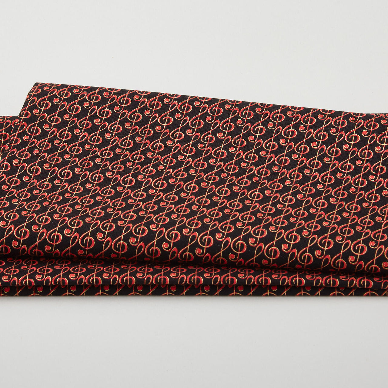 Christmas Musical - Musical G-Clef Black/Red Metallic 2 Yard Cut