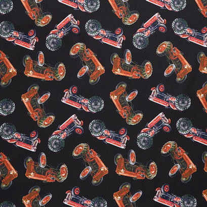 Novelty - Tossed Farm Tractors Black Yardage