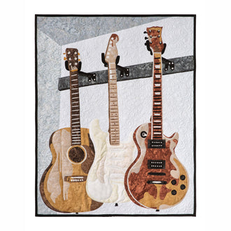 Man Sewing Unstrung Heroes Guitar Kit