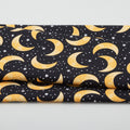 Spooky Friends - Tossed Moons & Stars Glow Black One Yard Cut Primary Image