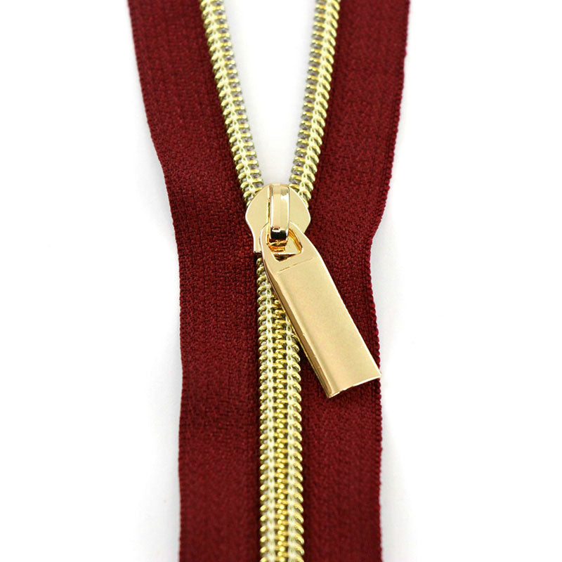 Sallie Tomato #5 Nylon Zippers & Pulls - Burgandy with Gold Coil Primary Image